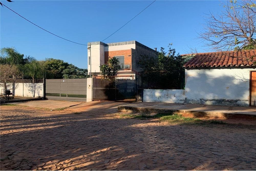 Terreno con casa en Luque barrio laurelty, foto 1