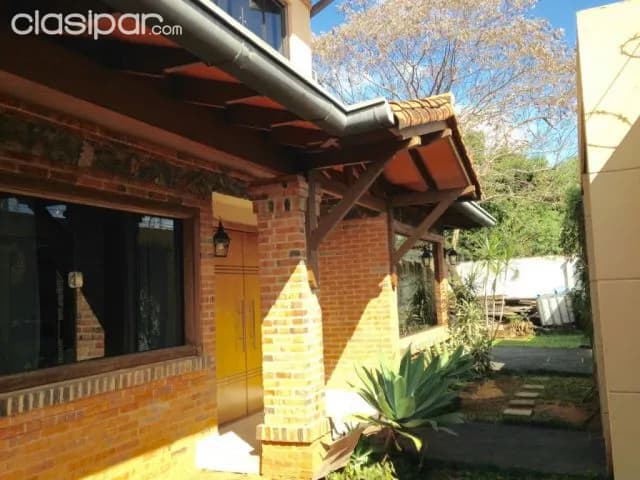 Bo Herrera prox. Avda. Mcal. Lopez: 960m2, elegante residencia, gran jardín, 650.000 usd — foto 3
