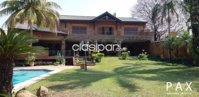 Villa Morra: Elegante residencia, 4 suites, gran jardín, piscina, 3.000 usd