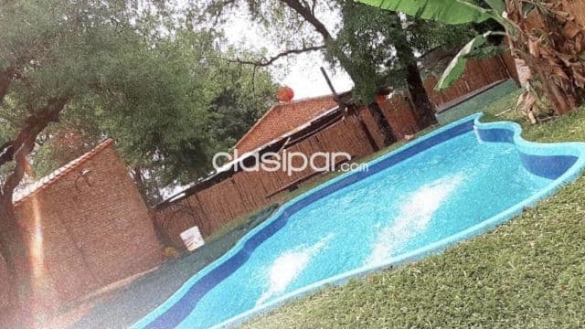 Recibo vehiculo 0 terreno de mi inters casa quinta con piscina, quincho con parrilla vendo — foto 1