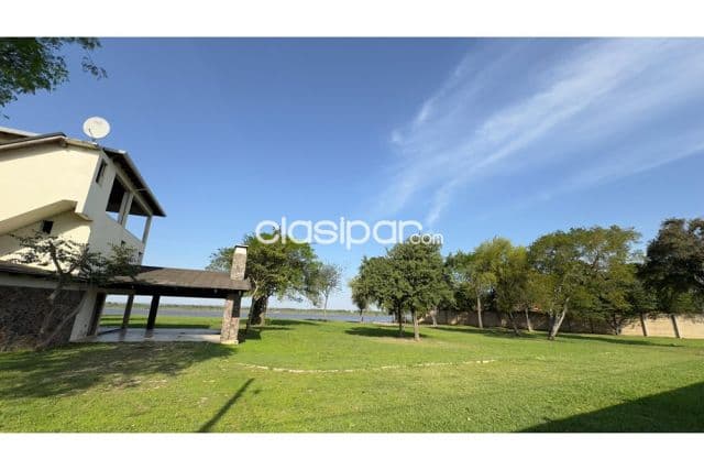 Casa quinta en remansito c/60 mtrs de frente s/el rio py a 4 min.transchaco-n.puente — foto 1
