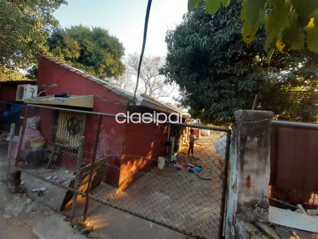 Propiedad en lambare con casa a remodelar o demoler detras del depósito de biggie