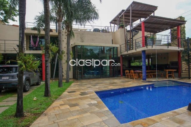 Mburucuyá: Elegante residencia minimalista, 5 dormitorios, jardín, piscina, 750.000 usd