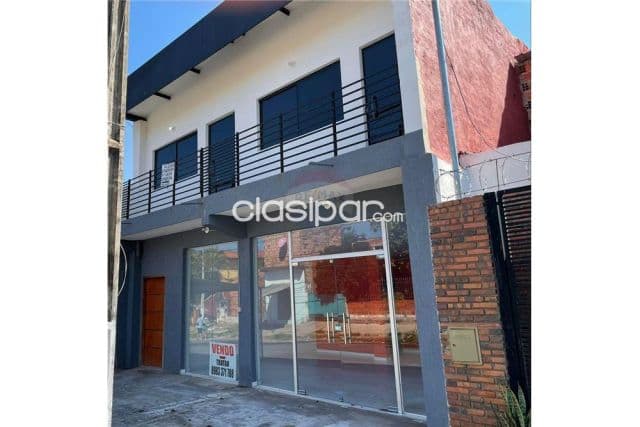 Edificio con salon y dos departamentos lambare zona colegio sek
